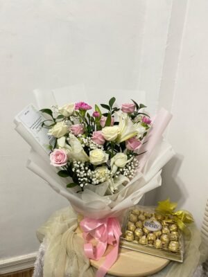 Pink-white roses bouquet with fererro